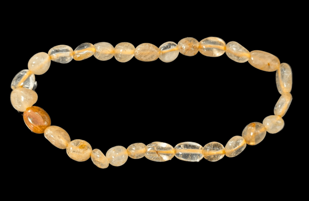 A Rutile Rock Crystal Bracelet tumbled stones